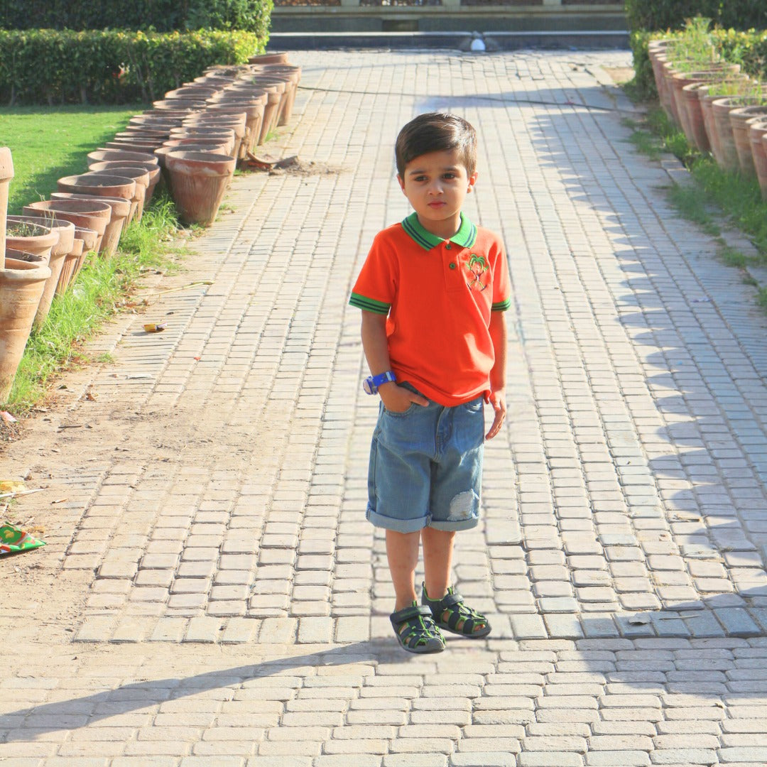 Boys orange palm tree embroidered polo